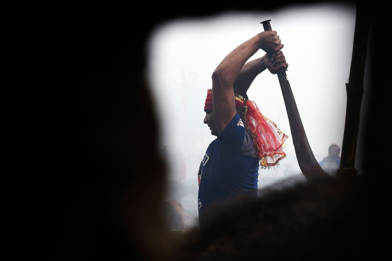 A Hindu devotee slaughters a buffalo as an offering during the Gadhimai festival on December 3. 