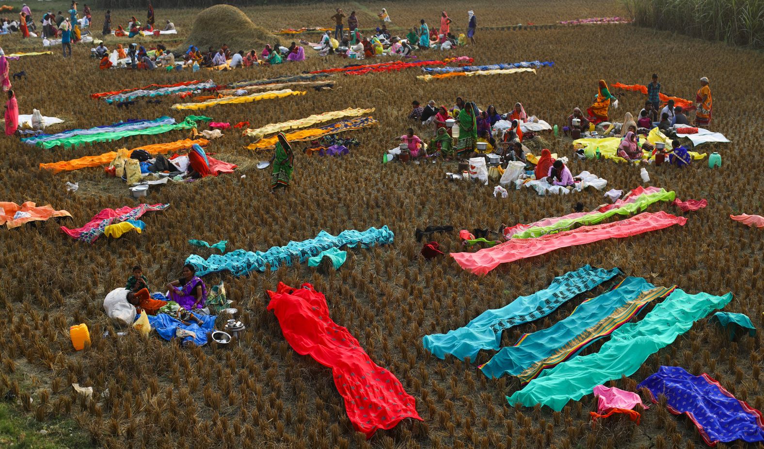 Devotees prepare to spend the night under open sky ahead of the festival's main day.