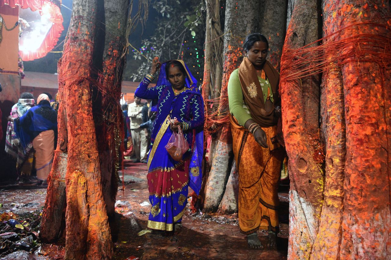 Hindu devotees perform a ritual at a temple near the sacrifice enclosure.