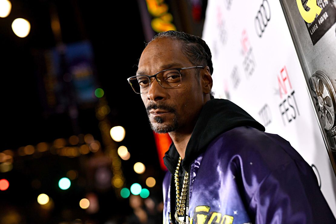 Snoop Dogg has got his mind on his money and his money on some wine.