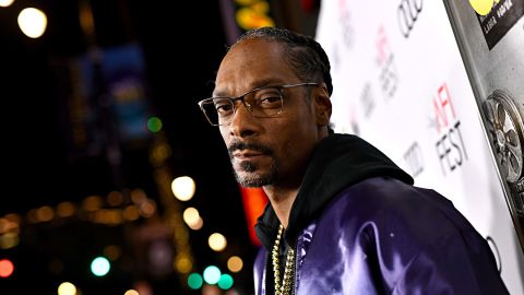 Snoop Dogg has got his mind on his money and his money on some wine.