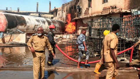 Members of the Sudanese Civil Defense put out the fire at a factory unit in northern Khartoum.
