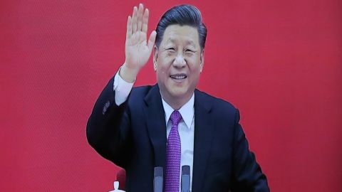 Chinese President Xi Jinping is seen on a TV screen as he attends a joint video conference with Russian President Vladimir Putin on December 2.