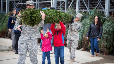 Many volunteers help Trees for Troops deliver the Christmas trees.
