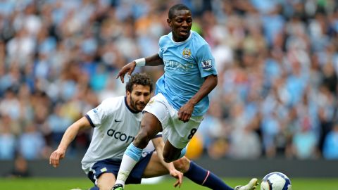 Wright-Phillips goes past the tackle from Carlos Cuellar of Aston Villa.