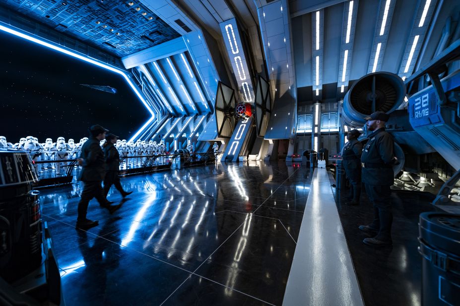 The full scale bay door looks out into space where First Order ships fly by like a jumbotron screensaver.