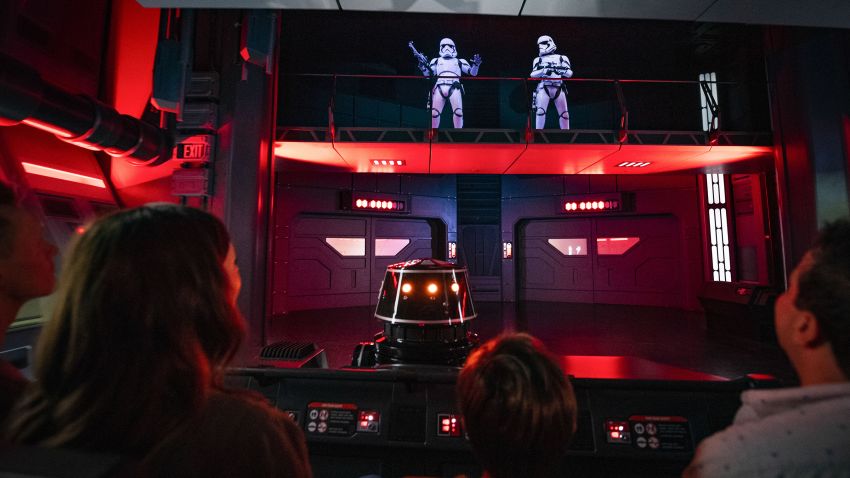 Guests flee First Order Stormtroopers onboard a Star Destroyer as part of Star Wars: Rise of the Resistance, the groundbreaking new attraction opening Dec. 5, 2019, inside Star Wars: Galaxy's Edge at Disney's Hollywood Studios in Florida and Jan. 17, 2020, at Disneyland Park in California. (Matt Stroshane, photographer)