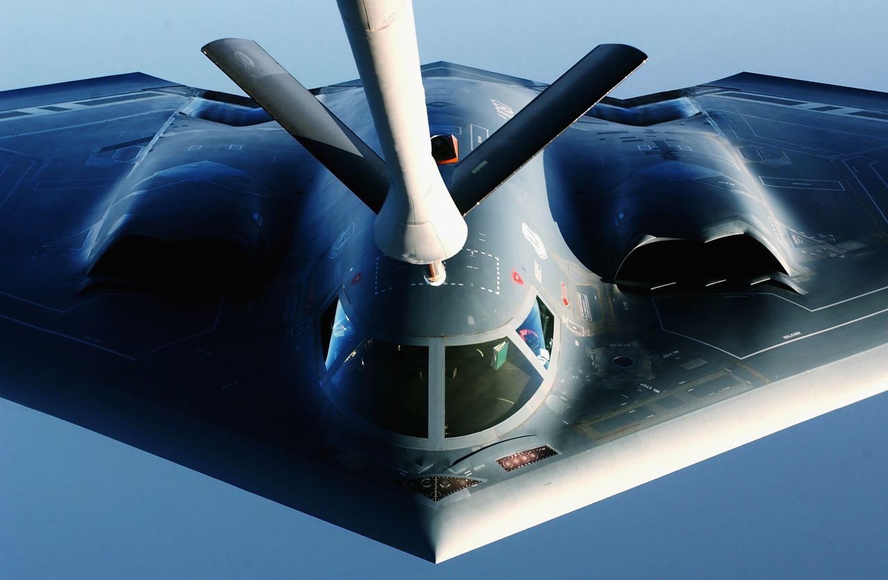 A B-2 Spirit Stealth Bomber receives fuel from a KC-135 Stratotanker.