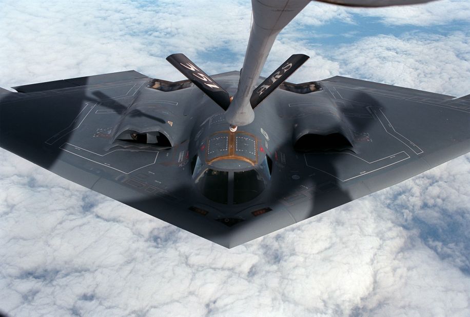 A B-2 Bomber approaches a KC-135R Stratotanker for refueling. During missions, the B-2 has to refuel approximately every six hours.