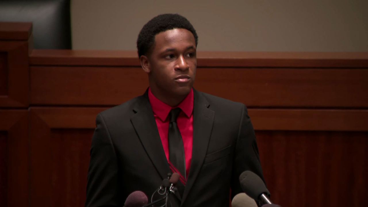 Brandt Jean accepts an ethical courage award from the Institute for Law Enforcement Administration.