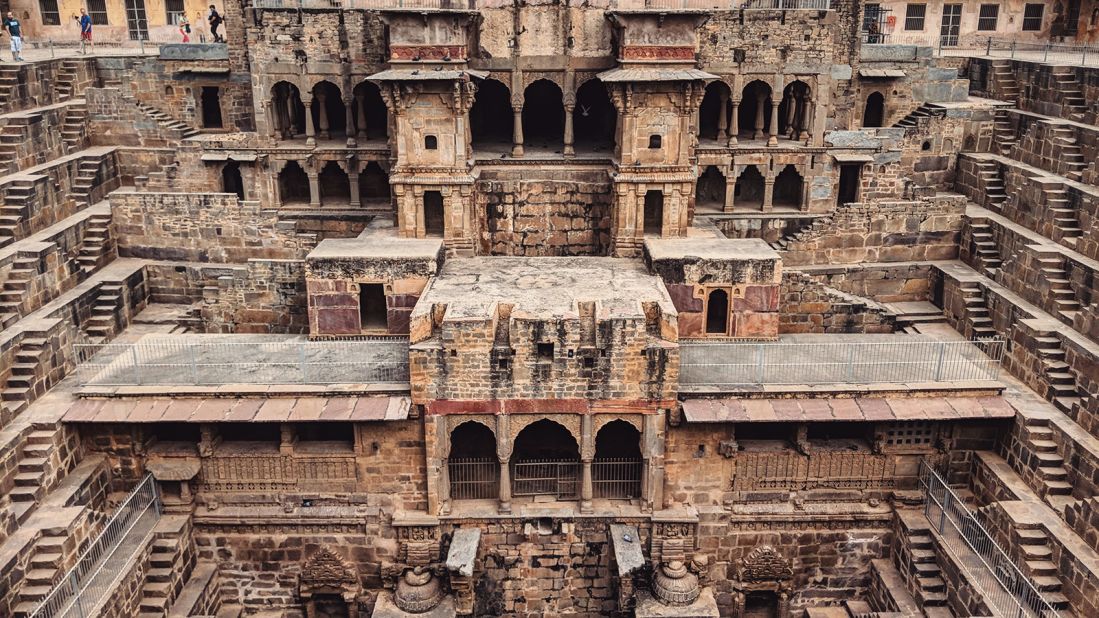 <strong>Chand Baori: </strong>Located in the Indian state of Rajasthan, Chand Baori features a carved temple at the center. Looks familiar? The scene in which Bruce Wayne escapes a subterranean prison in the film "The Dark Knight Rises" was shot here. 
