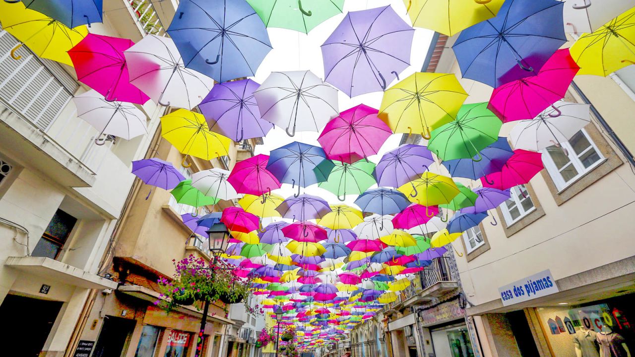 <strong>Umbrella Sky Project, Agueda, Portugal: </strong>The Umbrella Sky Project has transformed the four main streets of Agueda, including Rua Luis de Camoes, into colorful, umbrella-shaded paradises.