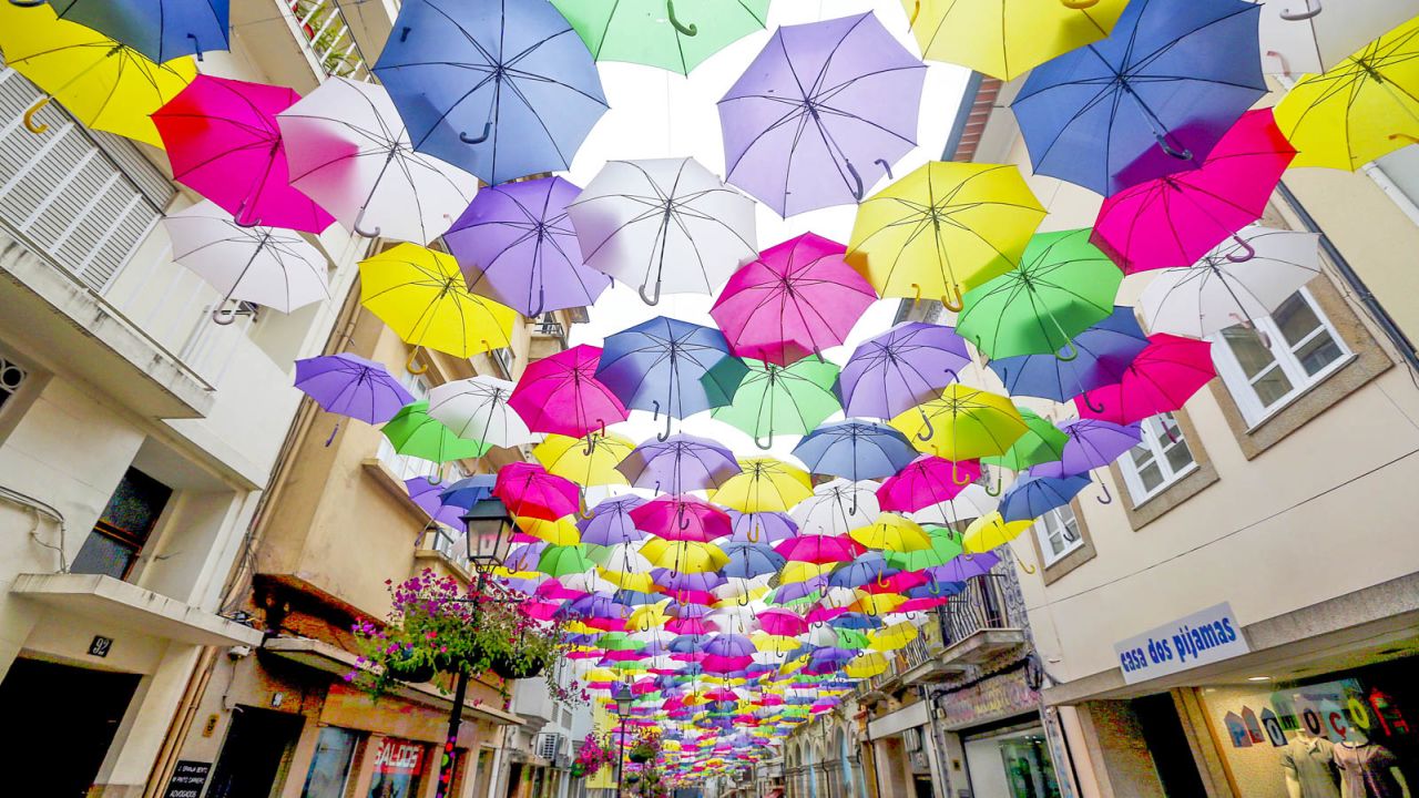The umbrellas protest from summer heat and provide a colorful backdrop.