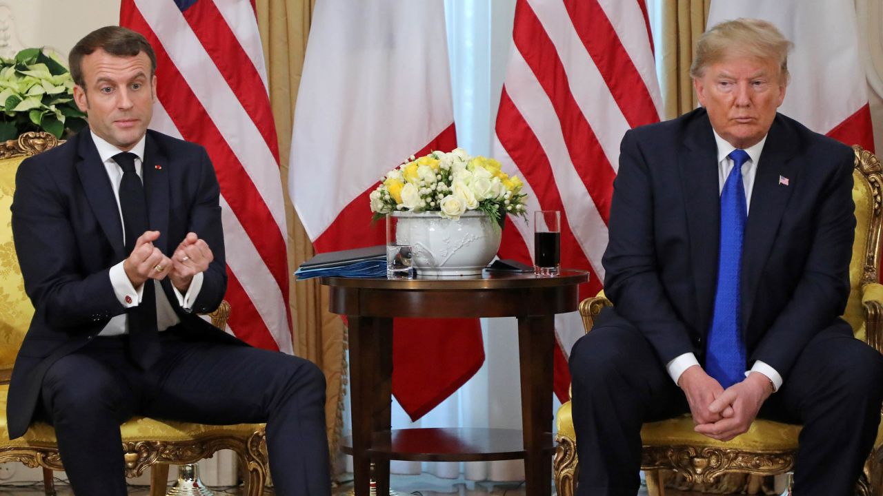 US President Donald Trump (R) France's President Emmanuel Macron react as they talk during their meeting at Winfield House, London on December 3, 2019. - NATO leaders gather Tuesday for a summit to mark the alliance's 70th anniversary but with leaders feuding and name-calling over money and strategy, the mood is far from festive. (Photo by ludovic MARIN / various sources / AFP) (Photo by LUDOVIC MARIN/AFP via Getty Images)