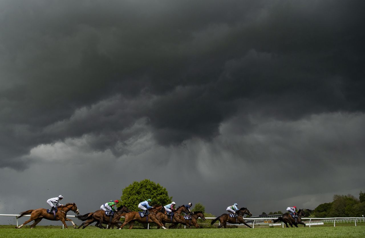 This dramatic picture was taken at Lingfield, moments before it "absolutely poured down with rain." Whitaker concedes a lot of days for a racing photographer are spent "living in waterproofs". 