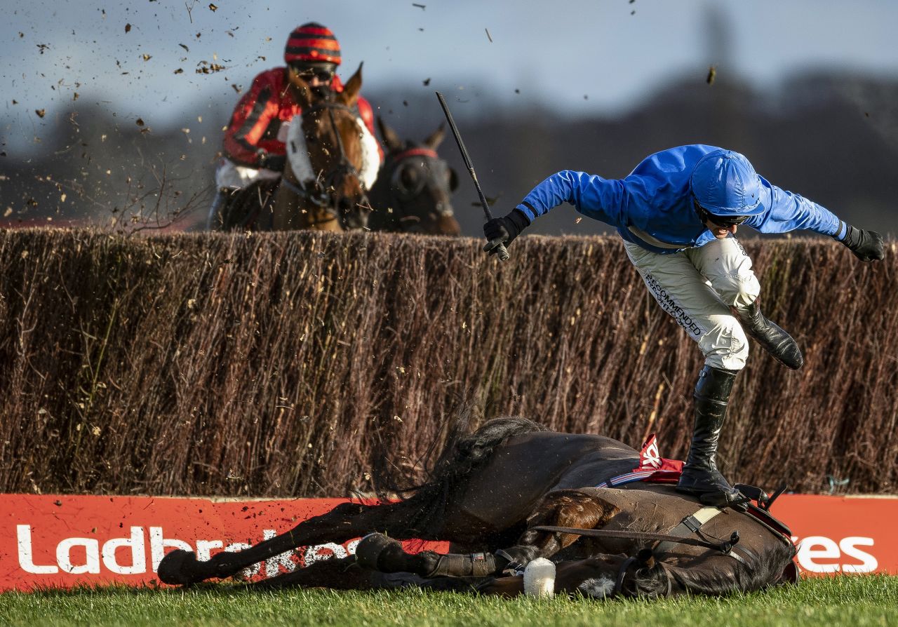 "Although it's unfortunate, falling jockeys make good photographs. He is making such a great shape, like a dancer," Whitaker said, confirming that both horse and jockey were safe after the fall. 