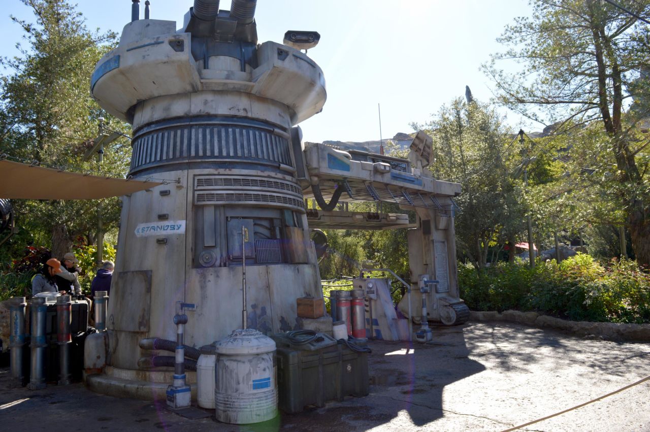 At the entrance of the Rise of the Resistance attraction at Disney's Star Wars land, there is a clue that the rebels are hiding in the trading port town of Black Spire Outpost. 