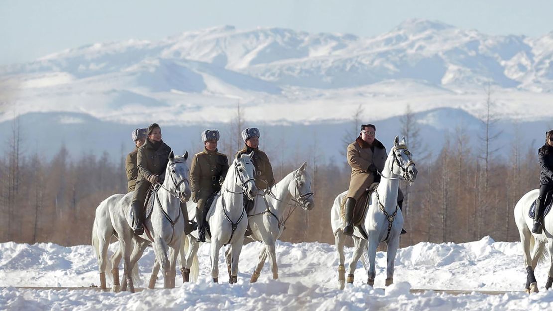 Kim Jong Un is seen riding a horse as he visits Mount Paektu in this KCNA photo.