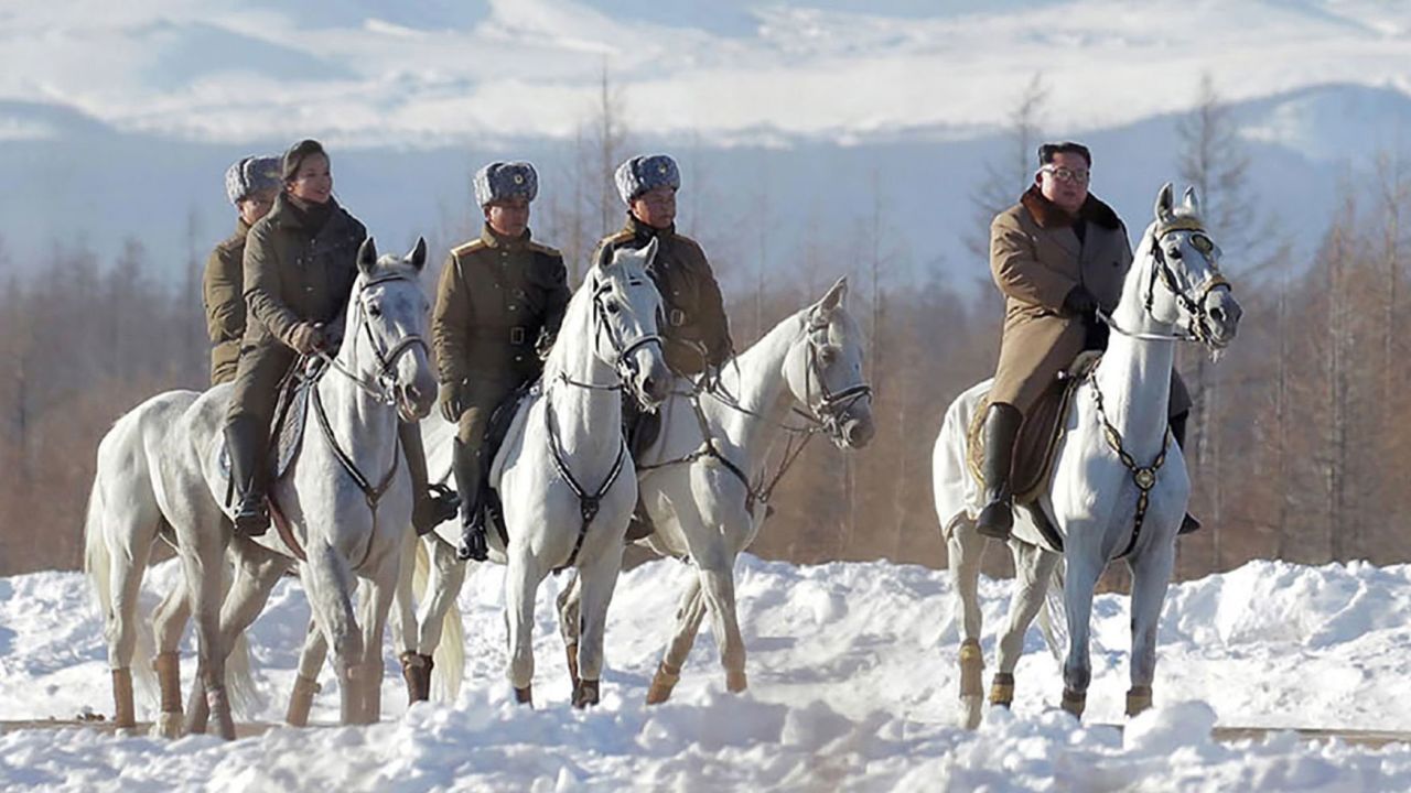 Kim Jong Un is seen riding a horse as he visits Mount Paektu in this KCNA photo.