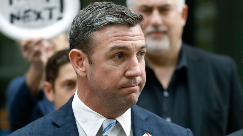 California Republican Rep. Duncan Hunter speaks after leaving federal court Tuesday, Dec. 3, 2019, in San Diego. Hunter gave up his year-long fight against federal corruption charges and pleaded guilty Tuesday to misusing his campaign funds, paving the way for the six-term Republican to step down.