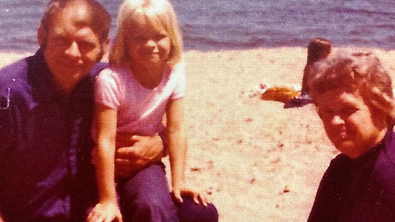 Robert and two of his children on vacation