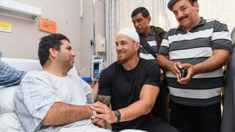 Sonny Bill Williams speaks to a survivor of the shootings at Al Noor mosque in Christchurch.