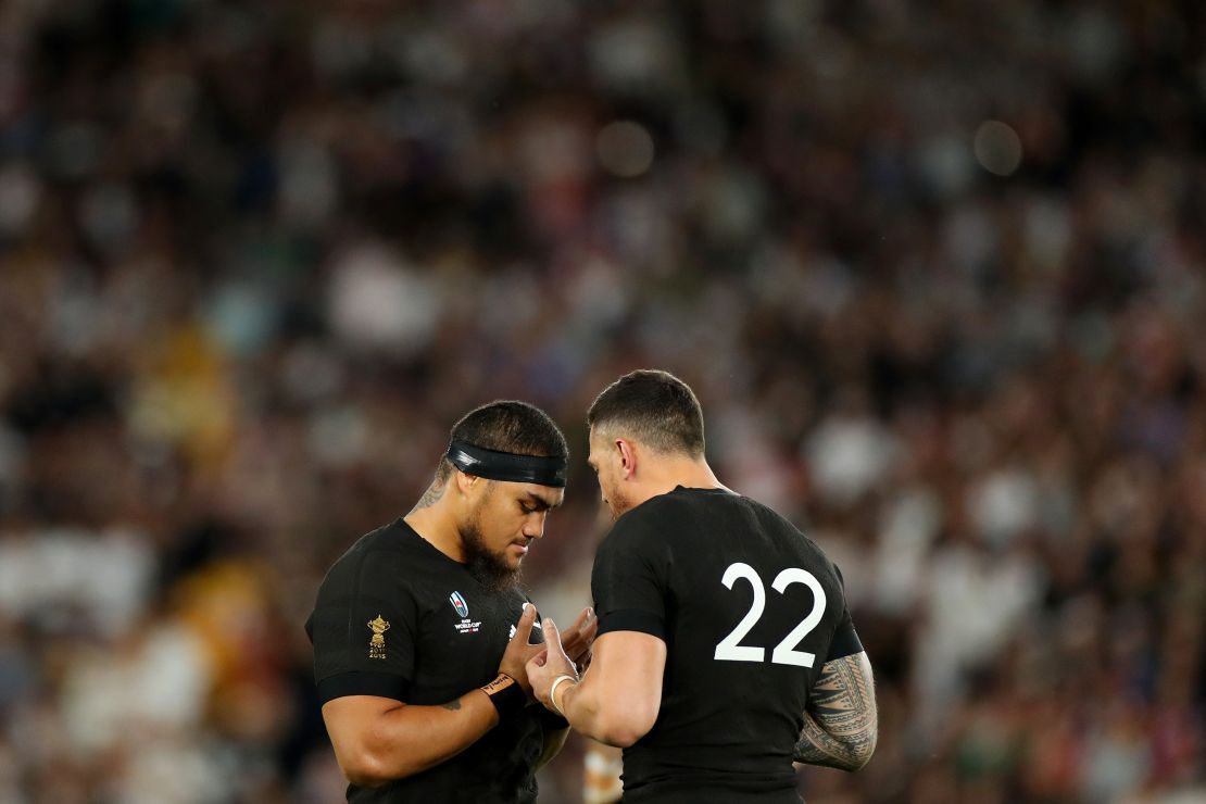 Sonny Bill Williams and Ofa Tuungafasi say a prayer following New Zealand's Rugby World Cup semifinal. 