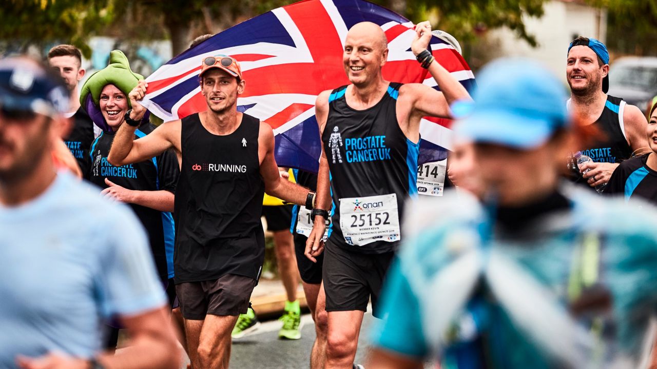 Butter runs with his friend Kevin Webber at the Athens Marathon in November.