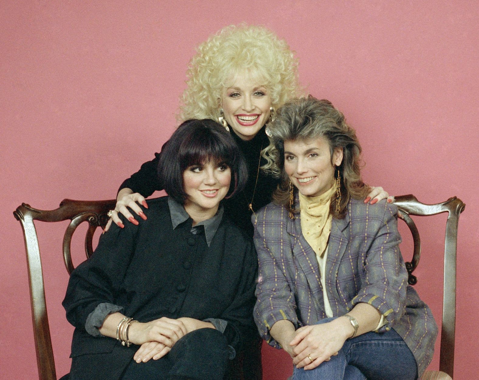 Ronstadt had known country superstars Dolly Parton and Emmylou Harris (center and right) for years by the time the three decided to release the album "Trio." The record, which arrived in 1987, went platinum; gave the stars another No. 1 with "To Know Him Is To Love Him"; and won a Grammy for best country performance by a duo or a group.