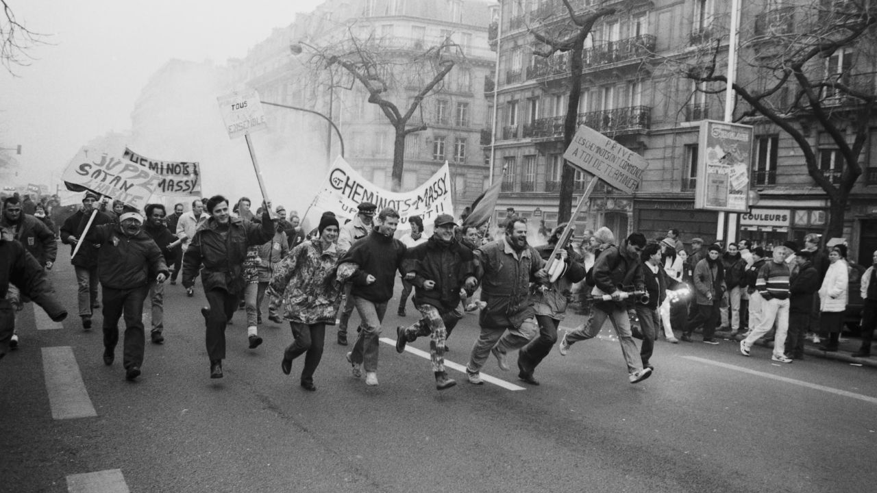 French railway workers take part in a street demonstration during one of a series of strikes in 1995.