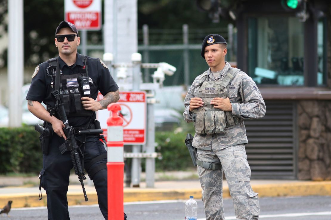 Security stands guard outside the main gate at Joint Base Pearl Harbor-Hickam, in Hawaii.