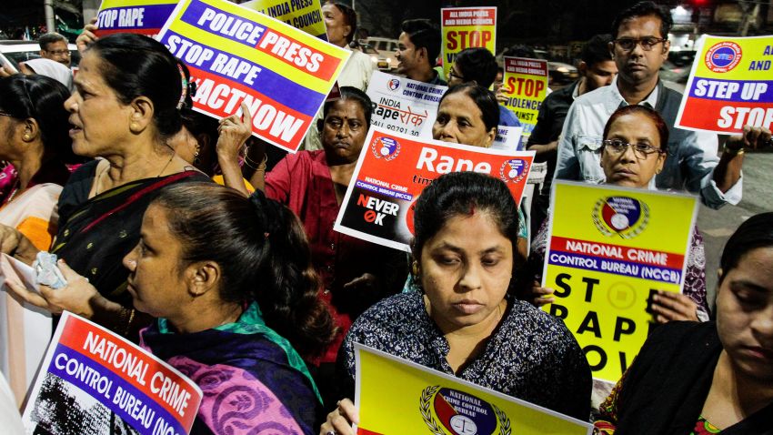 Indians  demanding justice in the case of a veterinarian who was gang-raped and killed last week, walk with placards during a protest in Kolkata, India, Wednesday, Dec. 4, 2019. The burned body of the 27-year-old woman was found Thursday morning by a passer-by in an underpass in the southern city of Hyderabad after she went missing the previous night. (AP Photo/Bikas Das)