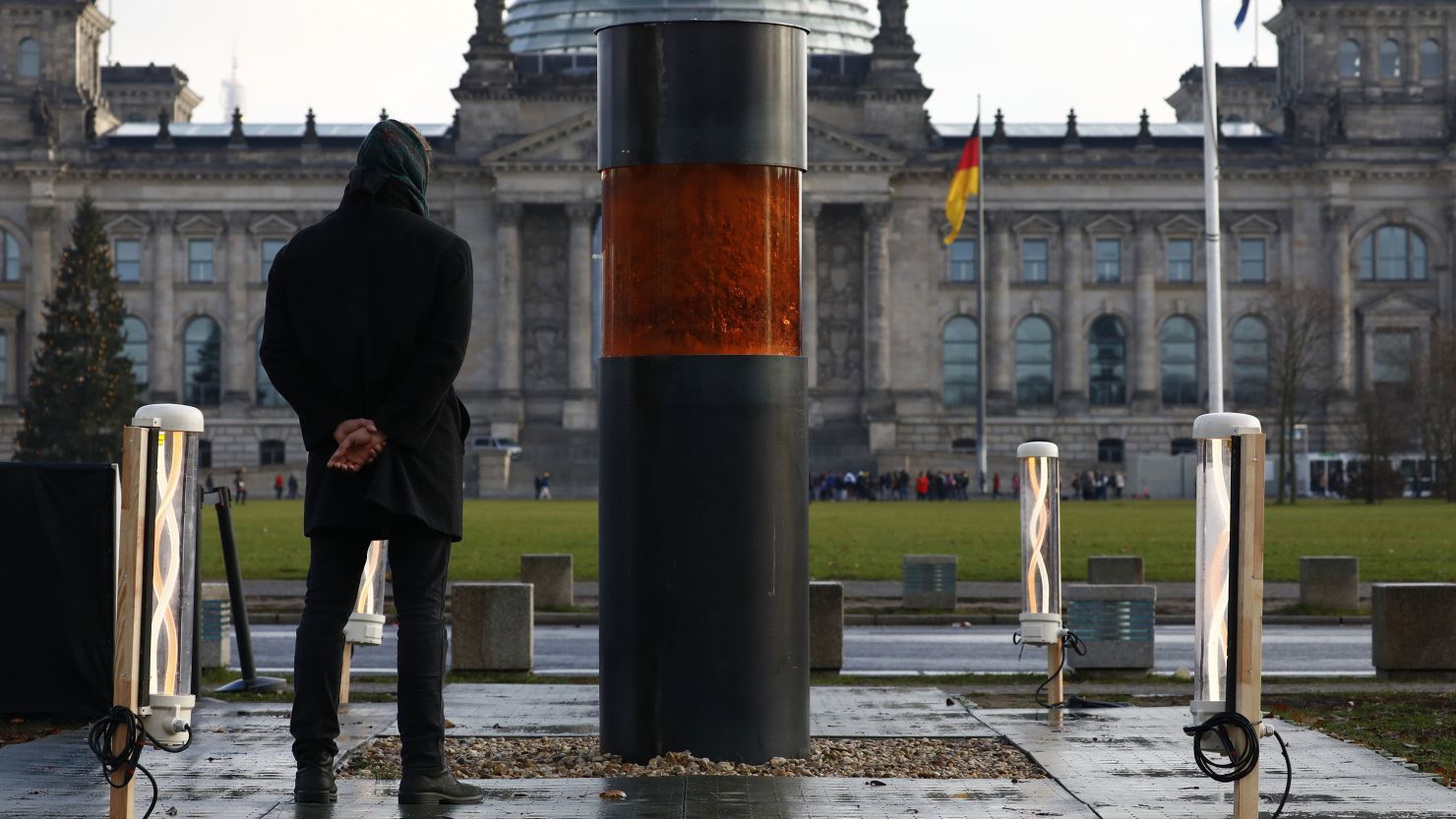 The urn stands in a memorial erected by the Center for Political Beauty opposite the German parliament.