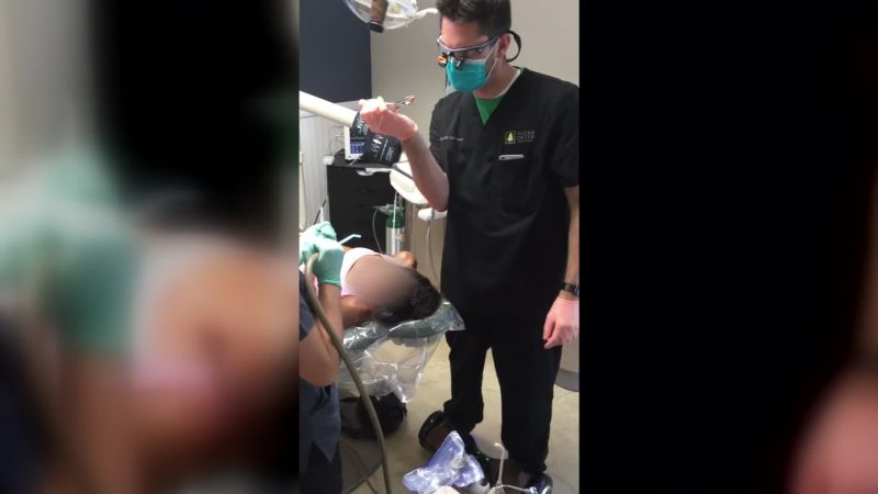 A dentist was filmed riding a hoverboard while extracting a patient’s tooth | CNN