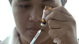 In this image made from video, a New Zealand health official prepares a measles vaccination at a clinic, Monday, Nov. 25, 2019, in Apia, Samoa. Authorities said Monday that a measles epidemic sweeping through Samoa continues to worsen with the death toll rising to 25, all but one of them young children. (Newshub via AP)