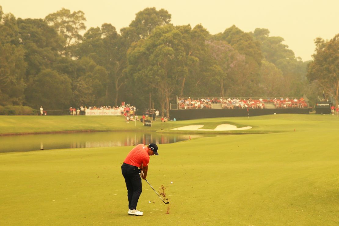 Sergio Garcia plays a shot in hazy conditions at the Australian Open. 