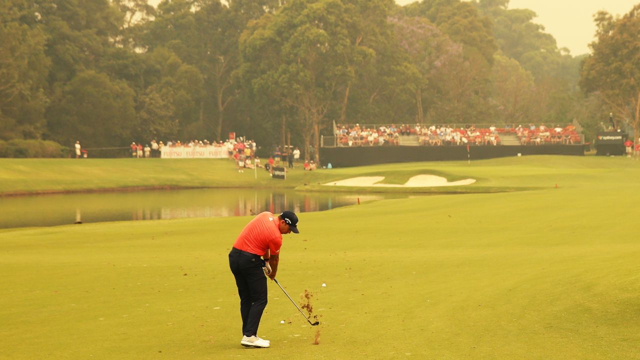 Sergio Garcia plays a shot in hazy conditions at the Australian Open. 
