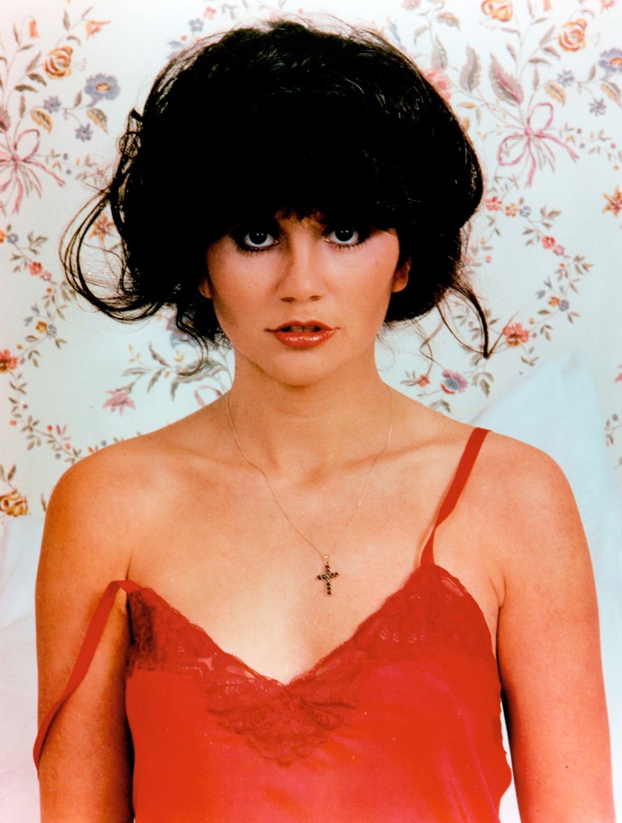 By the end of the 1970s, Ronstadt was rock music's "Million Dollar Woman," <a  target="_blank" target="_blank">as a Rolling Stone profile by Cameron Crowe</a> described. The photos that ran with the profile were taken by Annie Leibovitz, including this iconic shot of Ronstadt in red.  