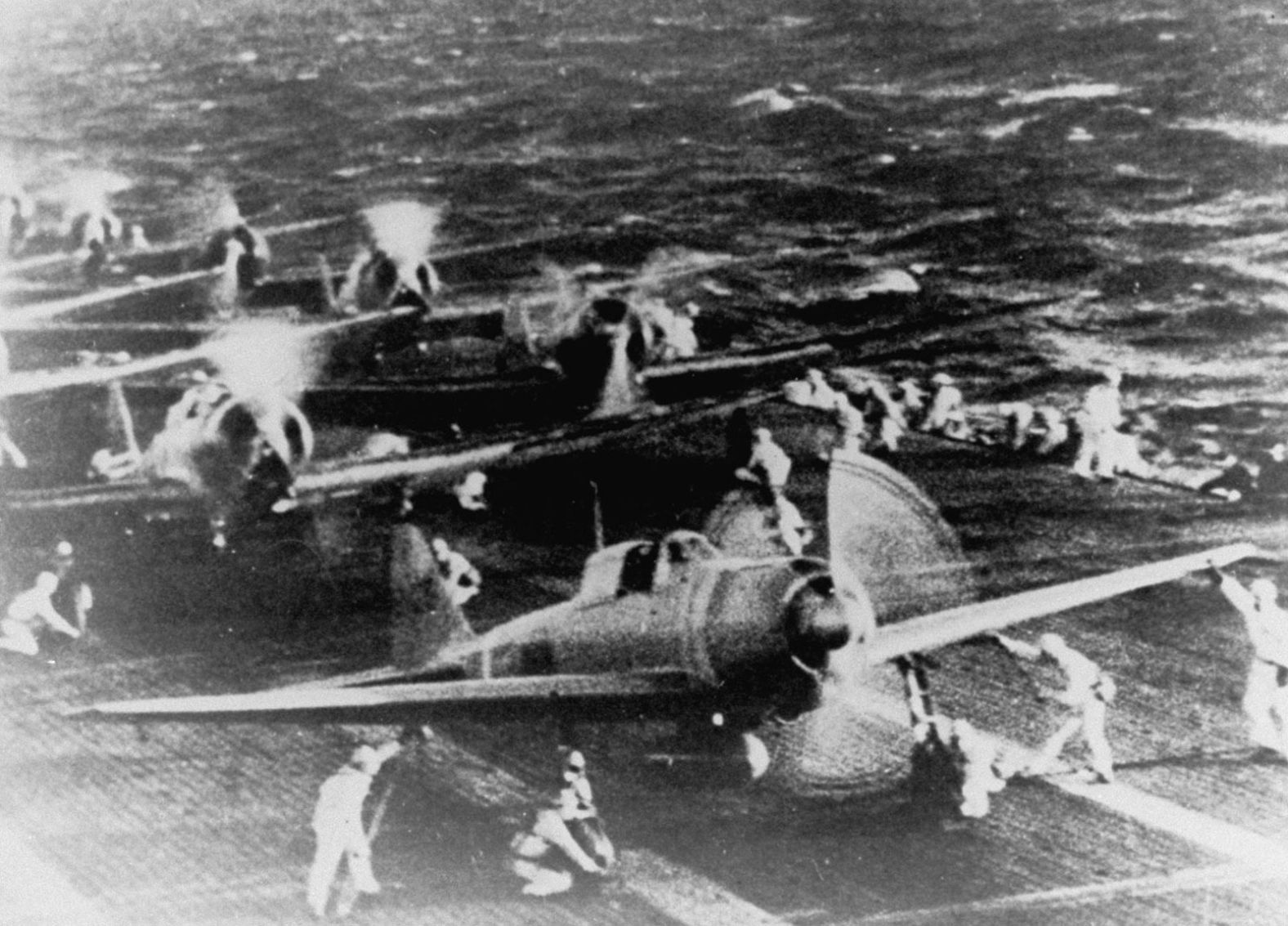 Crewmen of a Japanese aircraft carrier prepare fighter planes before the raid on Pearl Harbor.