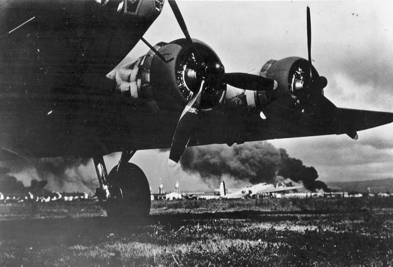 A US Army aircraft lands at Hickam Field on December 7. The base sustained heavy losses during the attack.