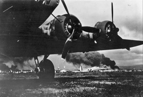 A US Army aircraft lands at Hickam Field on December 7. The base sustained heavy losses during the attack.