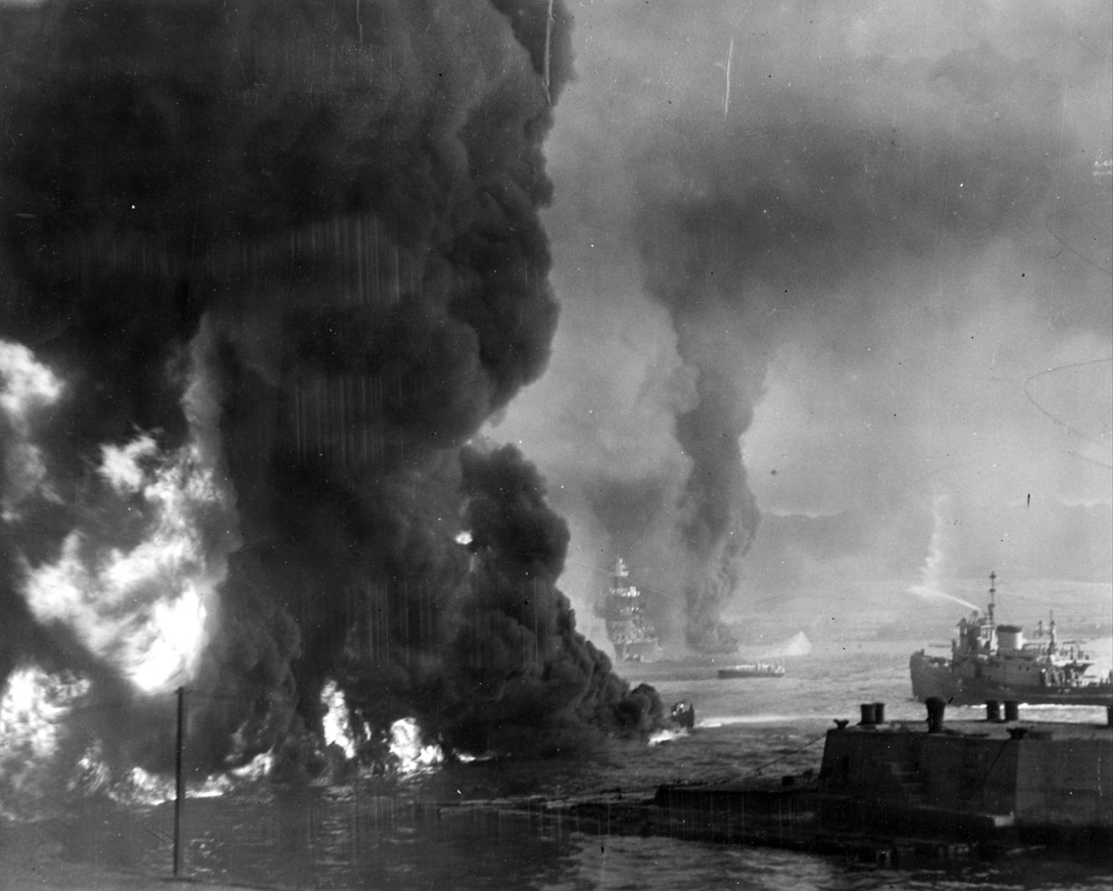 Oil burns on the ocean's surface near the Naval Air Station.