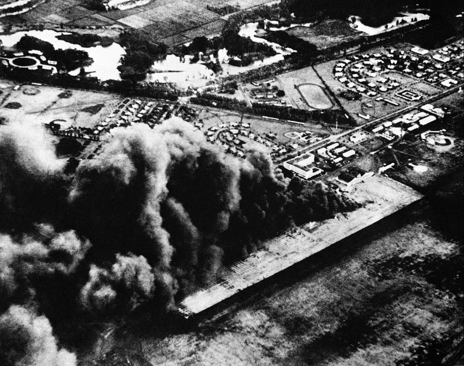 Smoke from burning oil billows over Hickam Field.