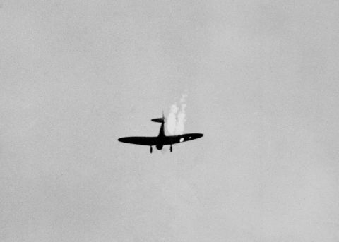 A Japanese plane plummets in flames after it was hit by US anti-aircraft.
