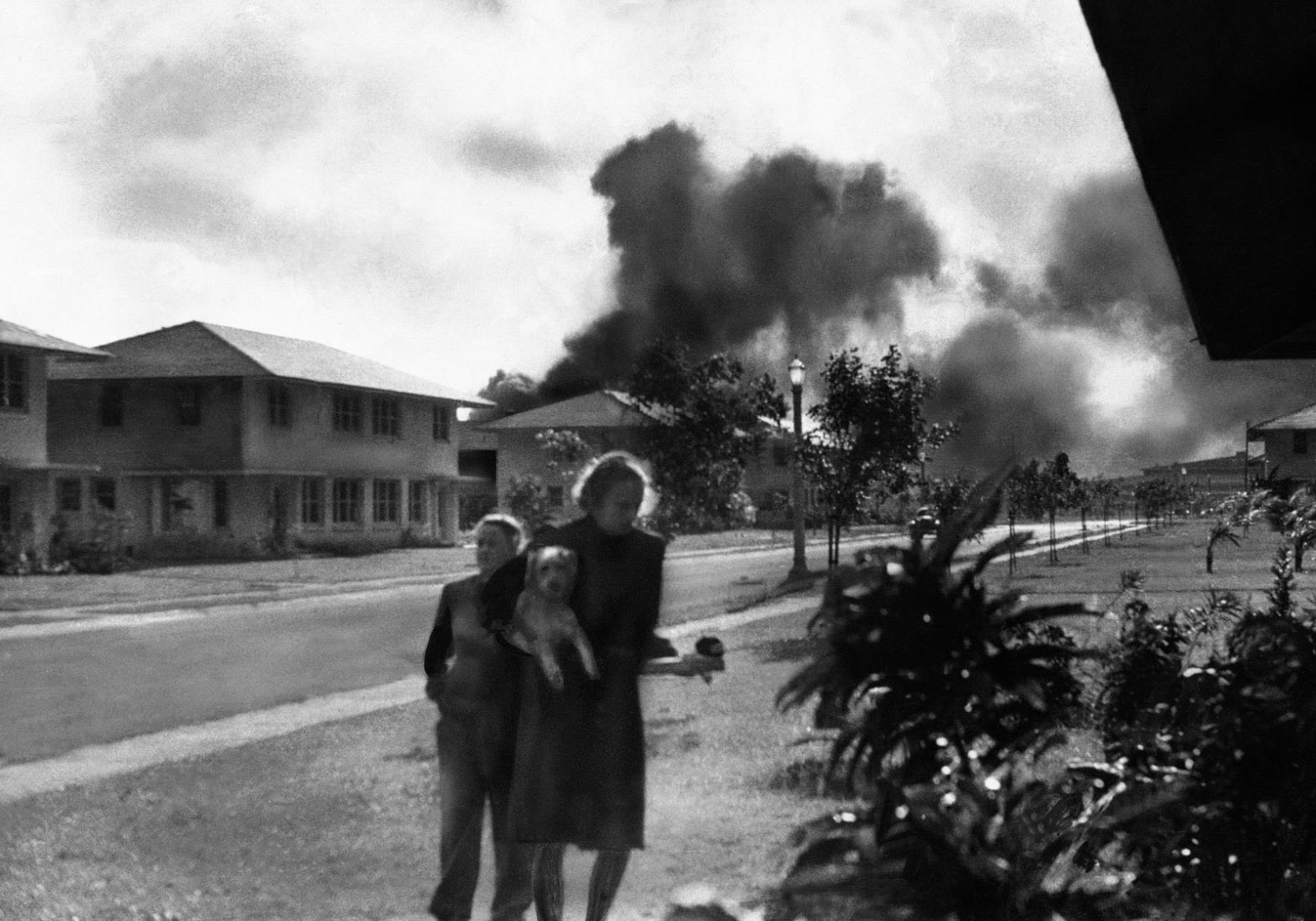 Wives of US military officers return to their residences after an explosion at Pearl Harbor.