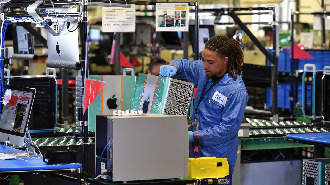 A worker assembles Apple's Mac Pros at the Flextronics computer manufacturing facility in Austin, Texas, on November 20, 2019. (Photo by MANDEL NGAN / AFP) (Photo by MANDEL NGAN/AFP via Getty Images)