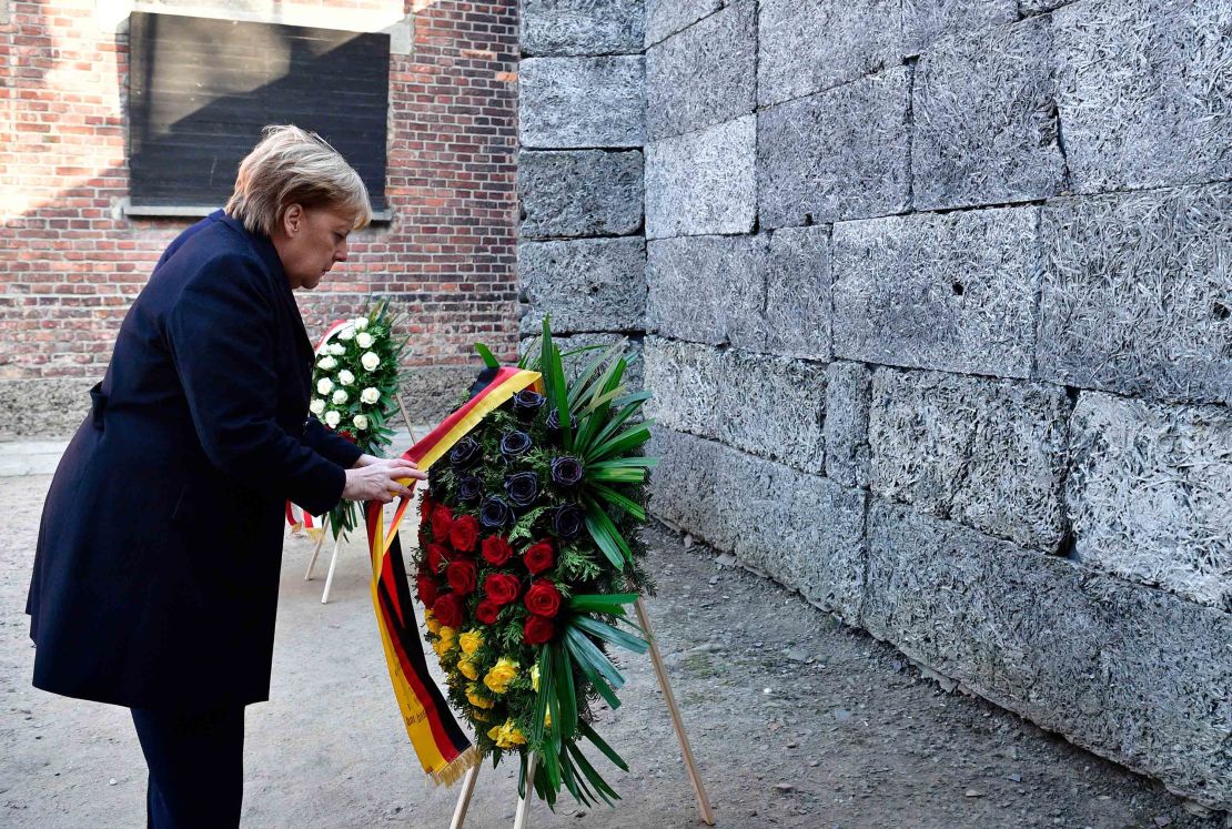 While pays her respect at the Auschwitz memorial. 