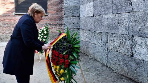 While pays her respect at the Auschwitz memorial.