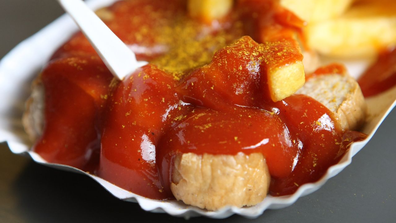 <strong>Currywurst in Berlin: </strong>For the uninitiated, this heaping plate consists of a fried pork sausage sliced into bite size chunks, doused in a spiced curried ketchup and dusted with curry powder. 