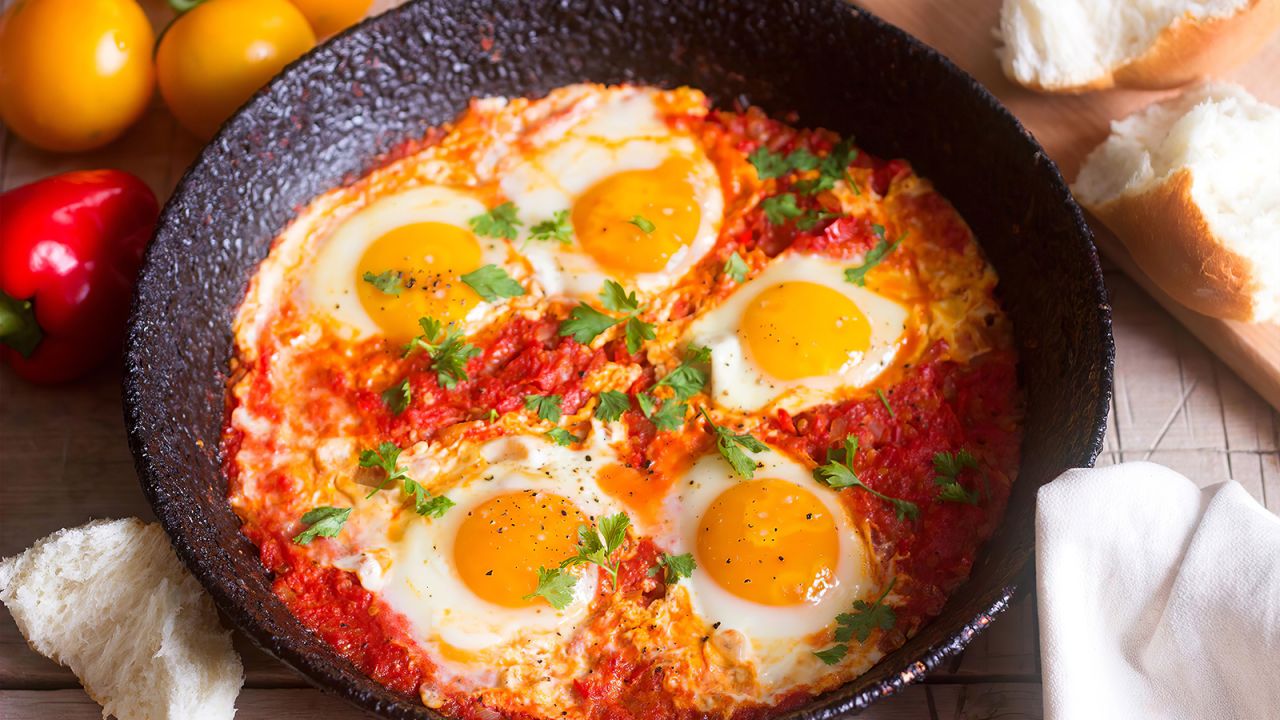 <strong>Shakshouka: </strong>Shakshouka is an ensemble of poached eggs, tomato sauce, peppers and garlic.